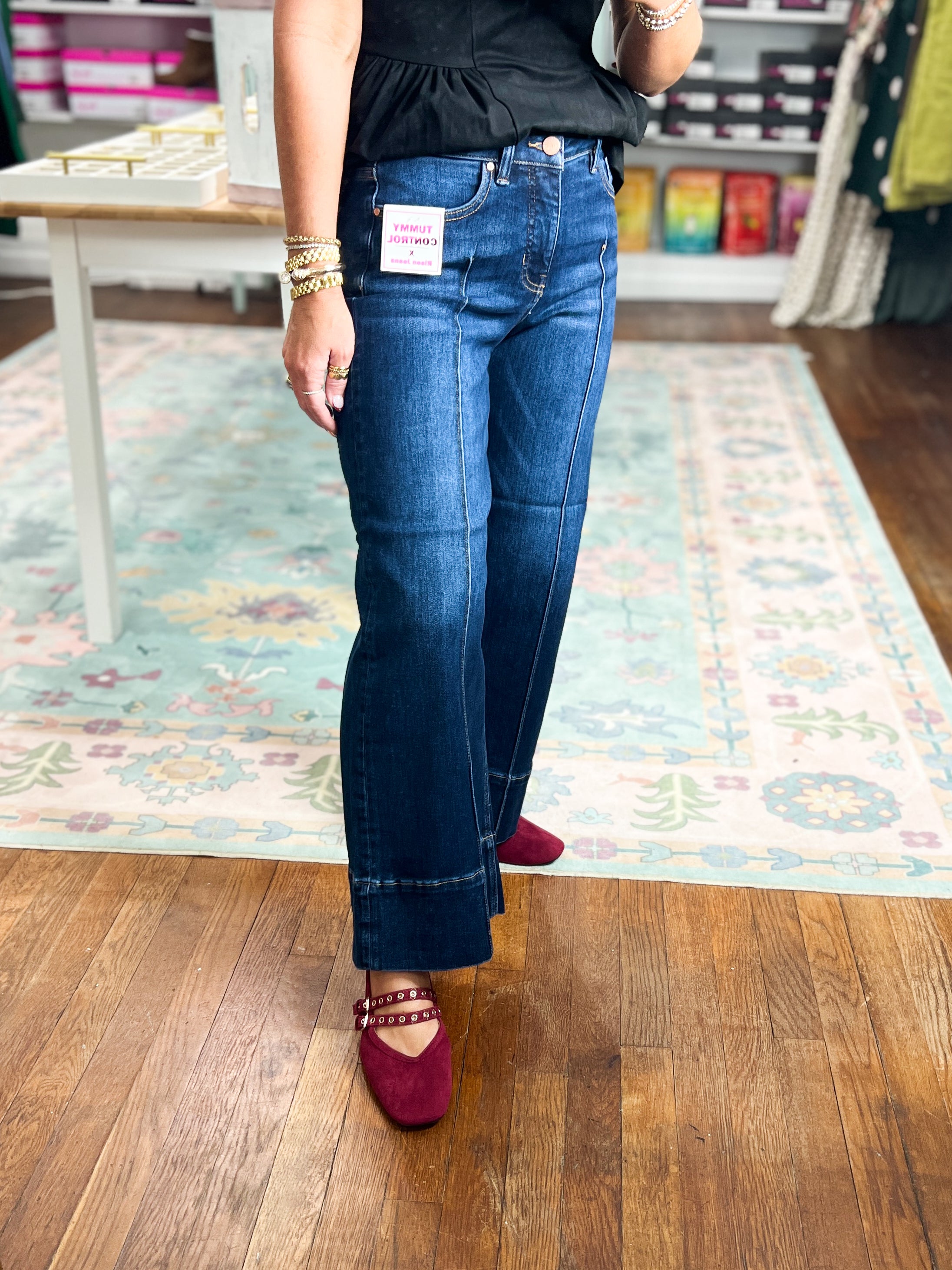 Deep blue mid-rise crop wide-leg jeans with pintuck front and ankle hem