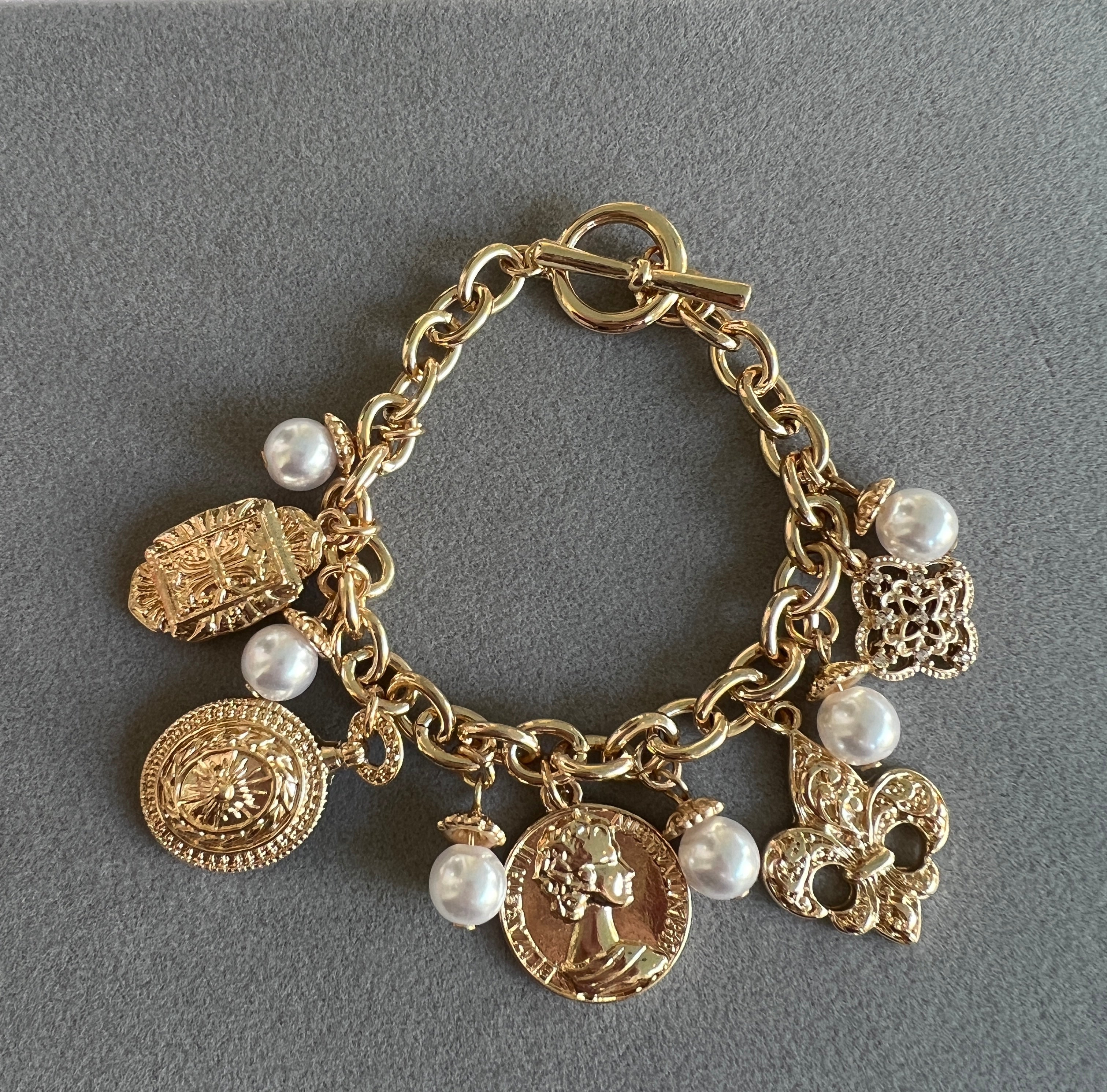 Fleur De Lis and Coin Charm Bracelet