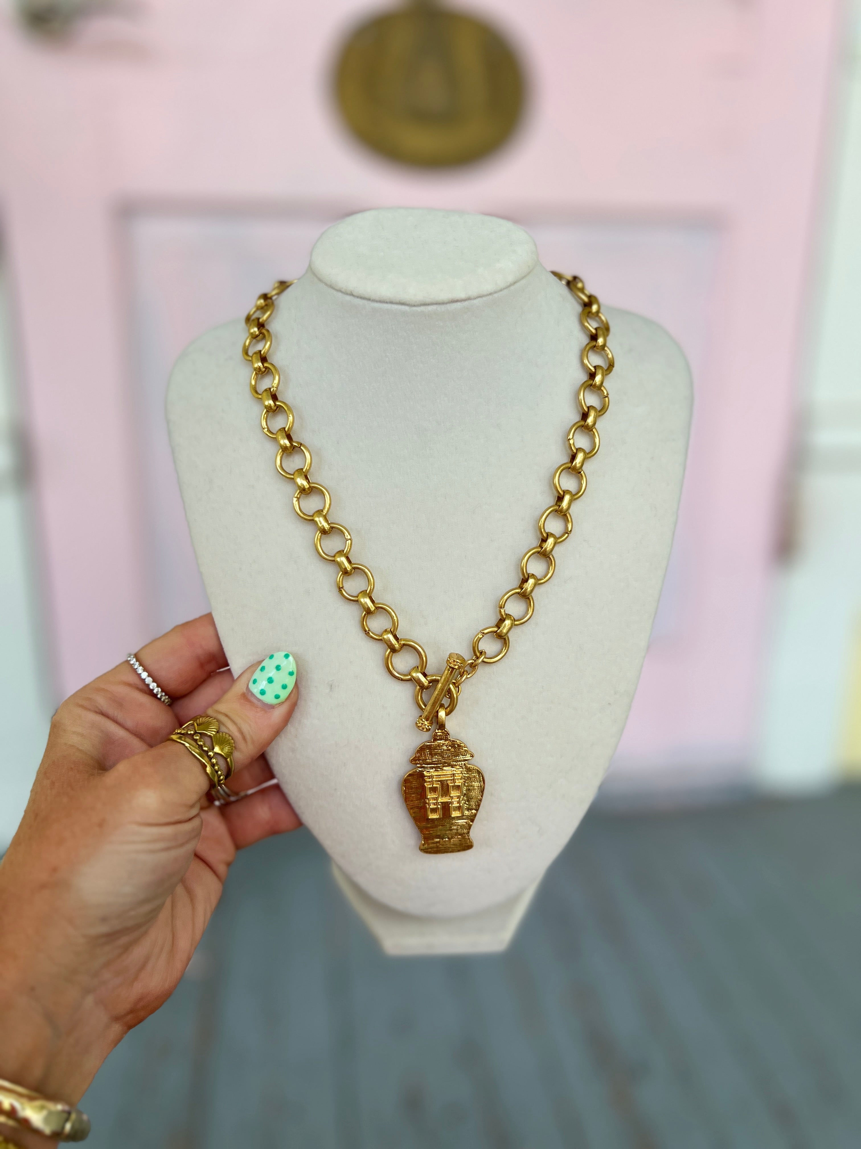 Gold-tone jar pendant necklace with oval link chain