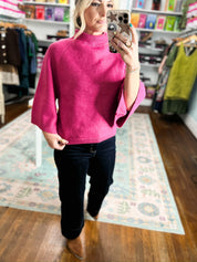Fuchsia mock neck knit sweater with ribbed collar and cuffed sleeves