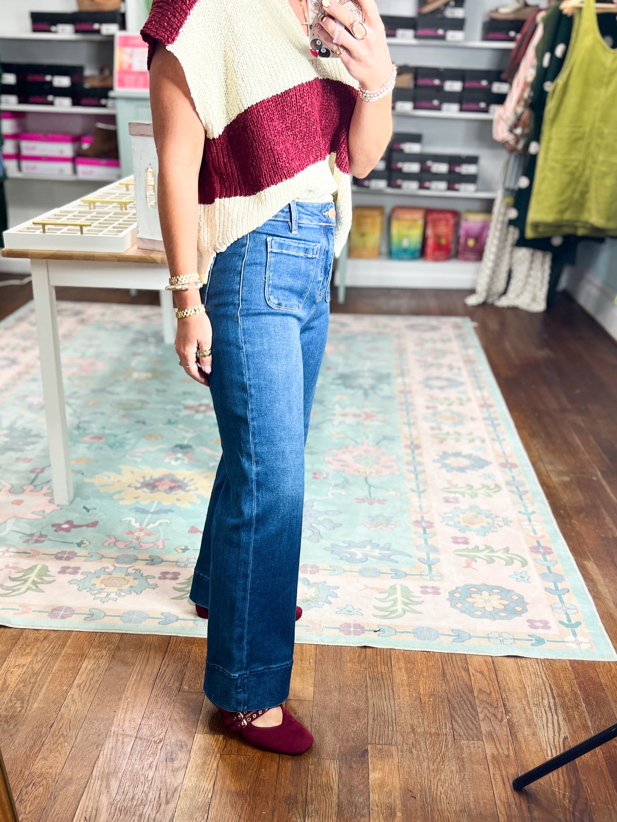 High-rise dark blue wide-leg jeans with front patch pockets, side view