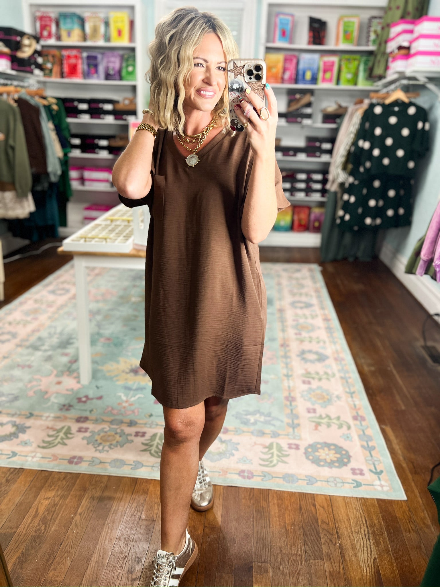 Brown sleeveless woven shift dress with rounded neckline and straight relaxed hem