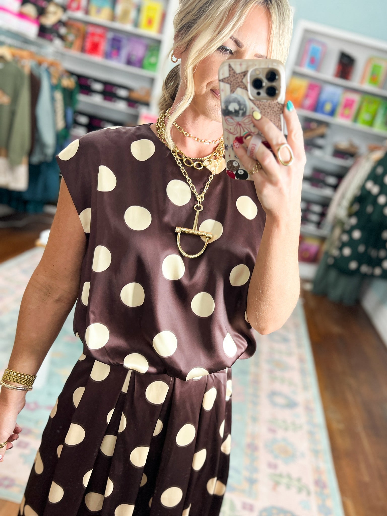 Brown polka-dot bubble top with short sleeves and scoop neckline, gathered waist