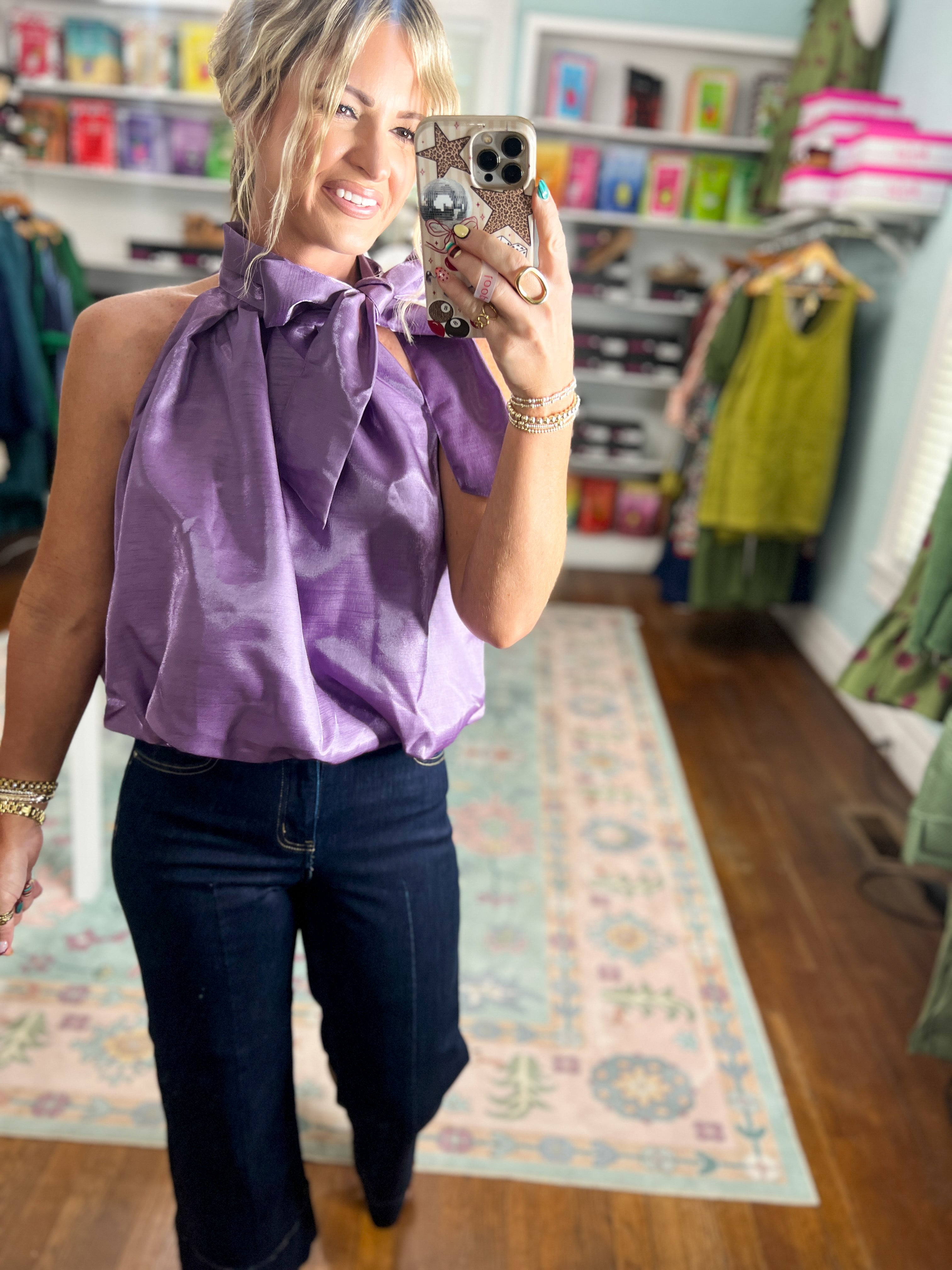 Purple sleeveless balloon top with ruffled collar and pleated front