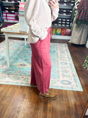Red wide-leg pants, side view, elastic waist and flowing wide legs