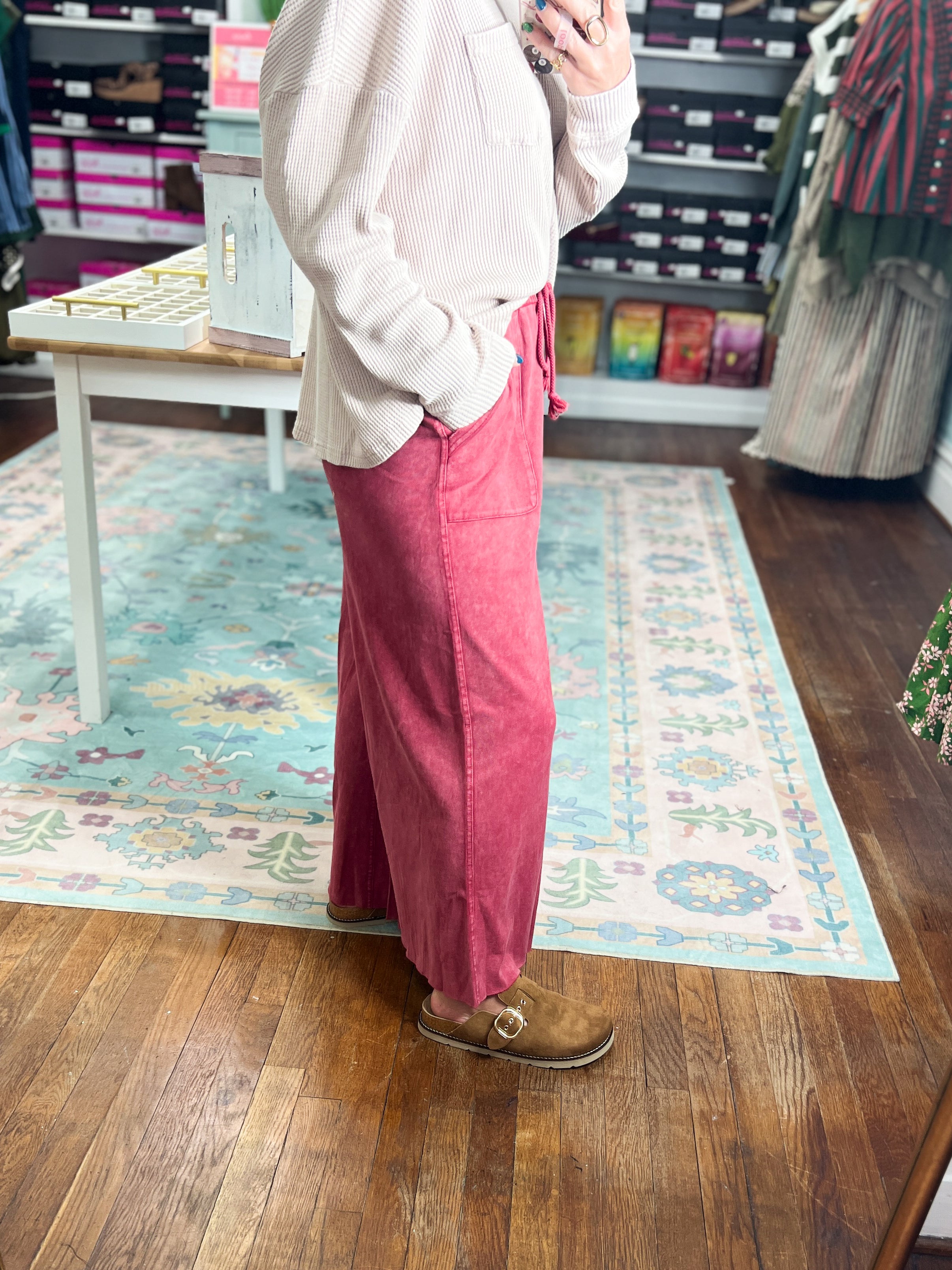 Red wide-leg pants, side view, elastic waist and flowing wide legs