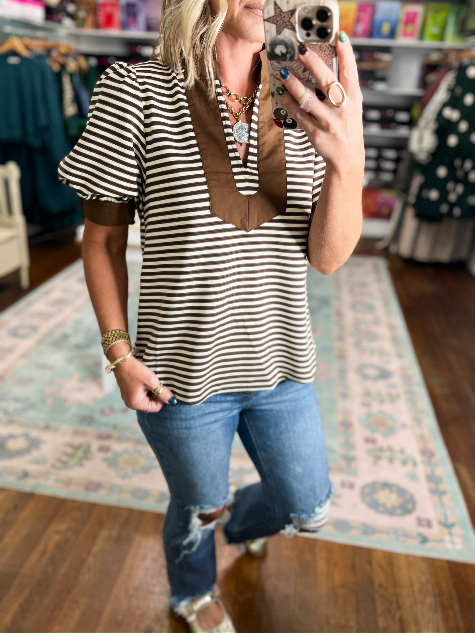 Striped short sleeve V-neck top with brown trim detail, front close-up