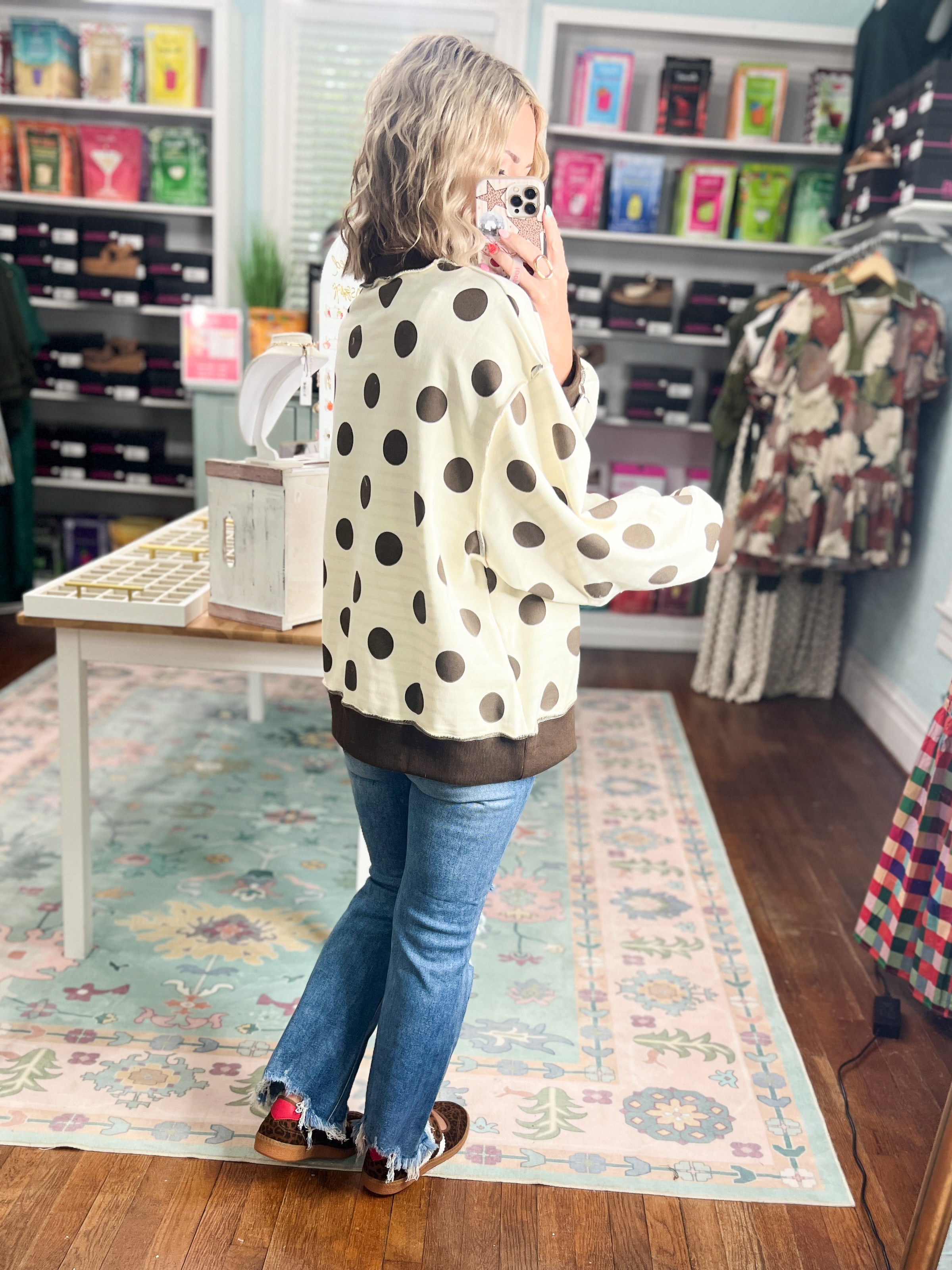Reversible mock neck sweatshirt in ivory with black polka dots and dark cuffs