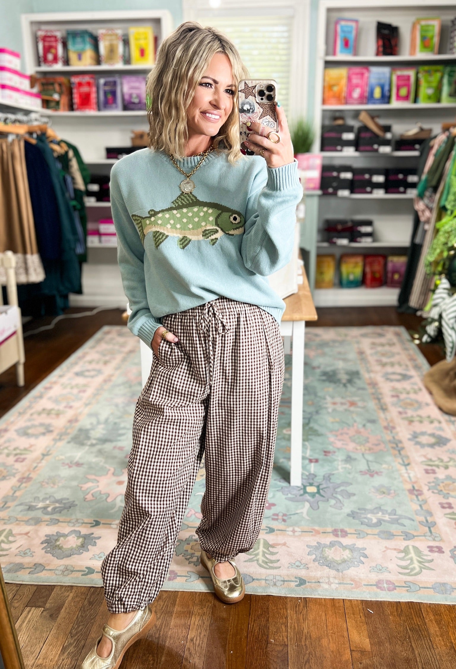 Sage crewneck sweater with a large fish graphic and ribbed cuffs and hem