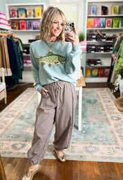 Sage crewneck sweater with a large fish graphic and ribbed cuffs and hem