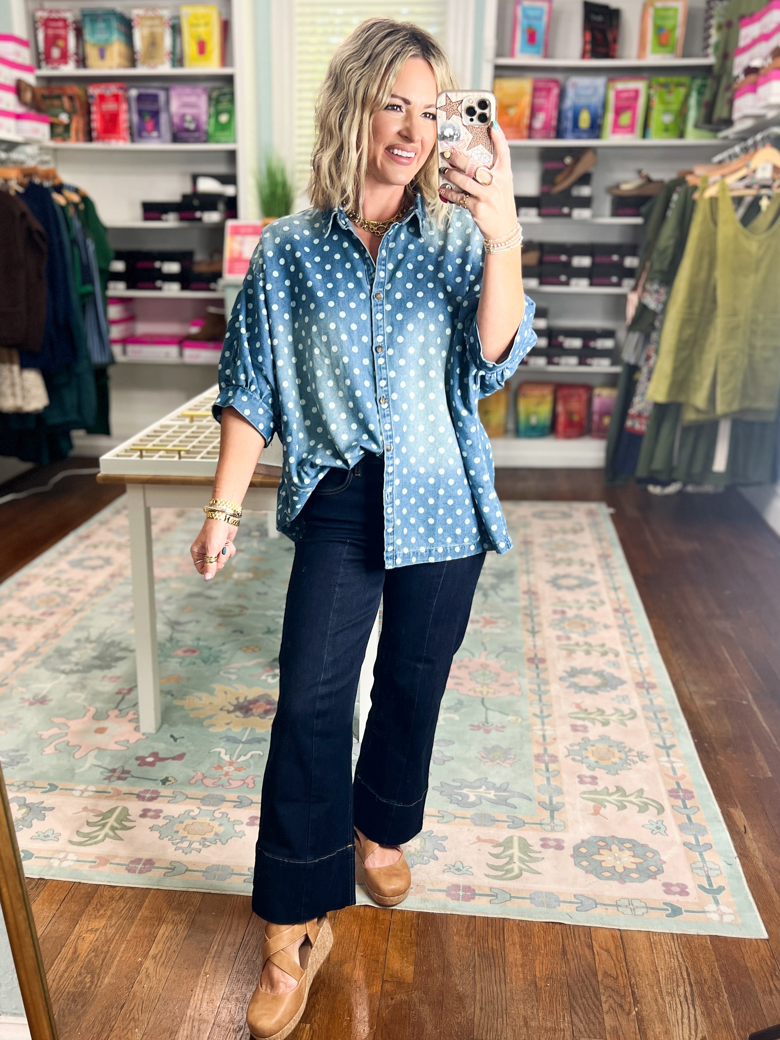 Light blue denim button-front shirt featuring white polka dots and short sleeves