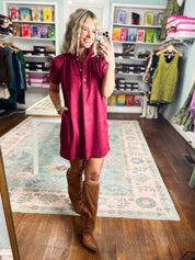 Plum short-sleeve mini dress with button-front opening