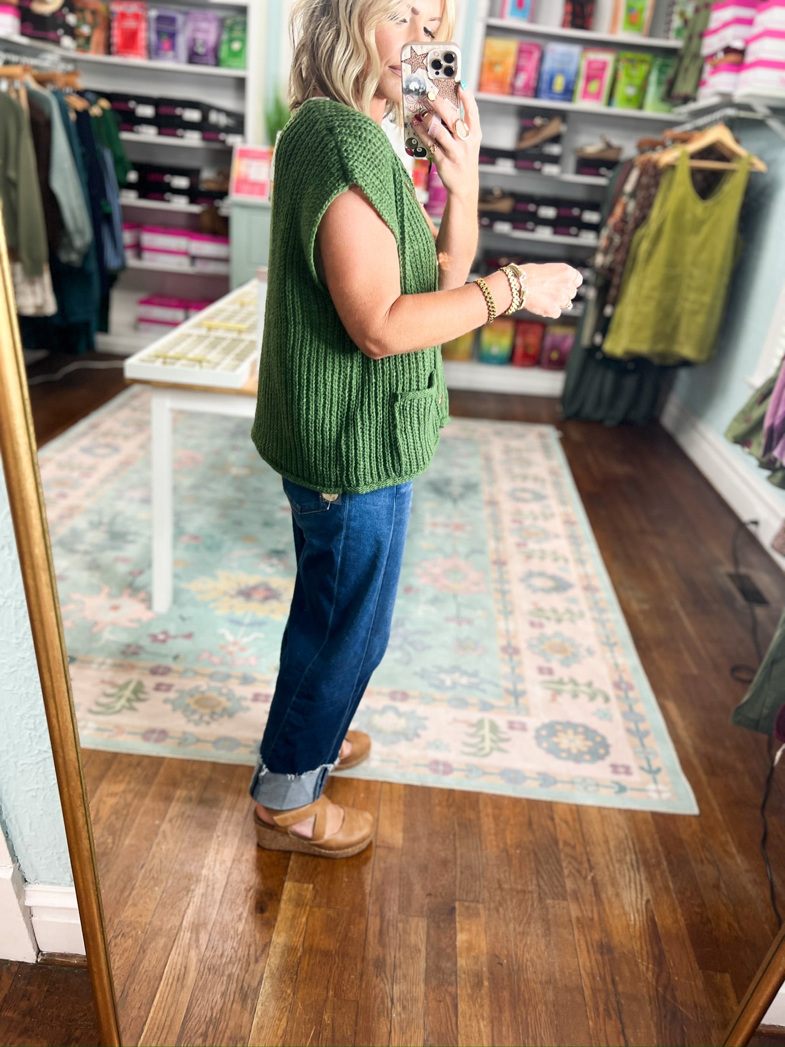 Army green ribbed knit sweater with short sleeves and button-front closure