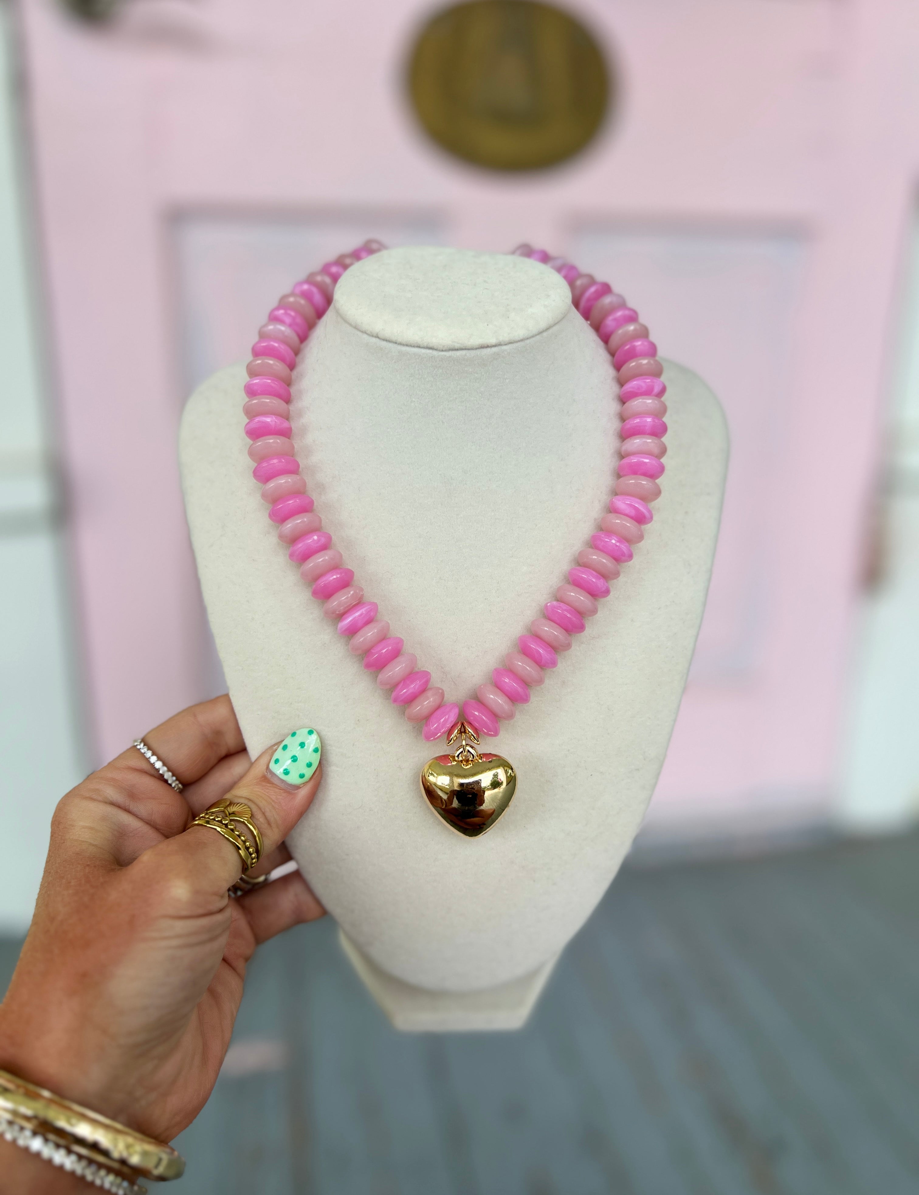 Pink wide beaded necklace with puffy heart charm pendant