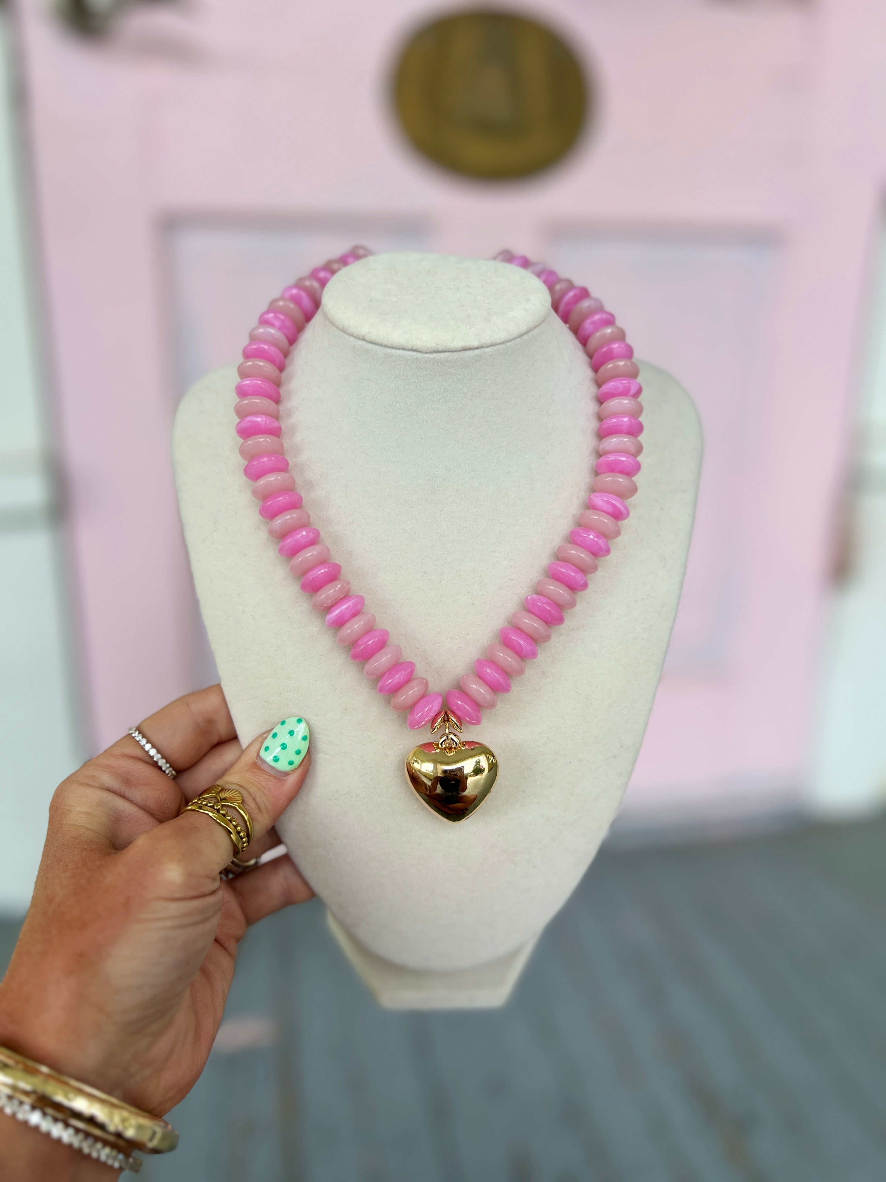Pink wide beaded necklace with puffy heart charm pendant