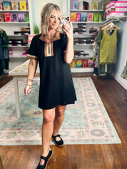 Black casual dress, short sleeves, relaxed fit, light V-neck yoke detail