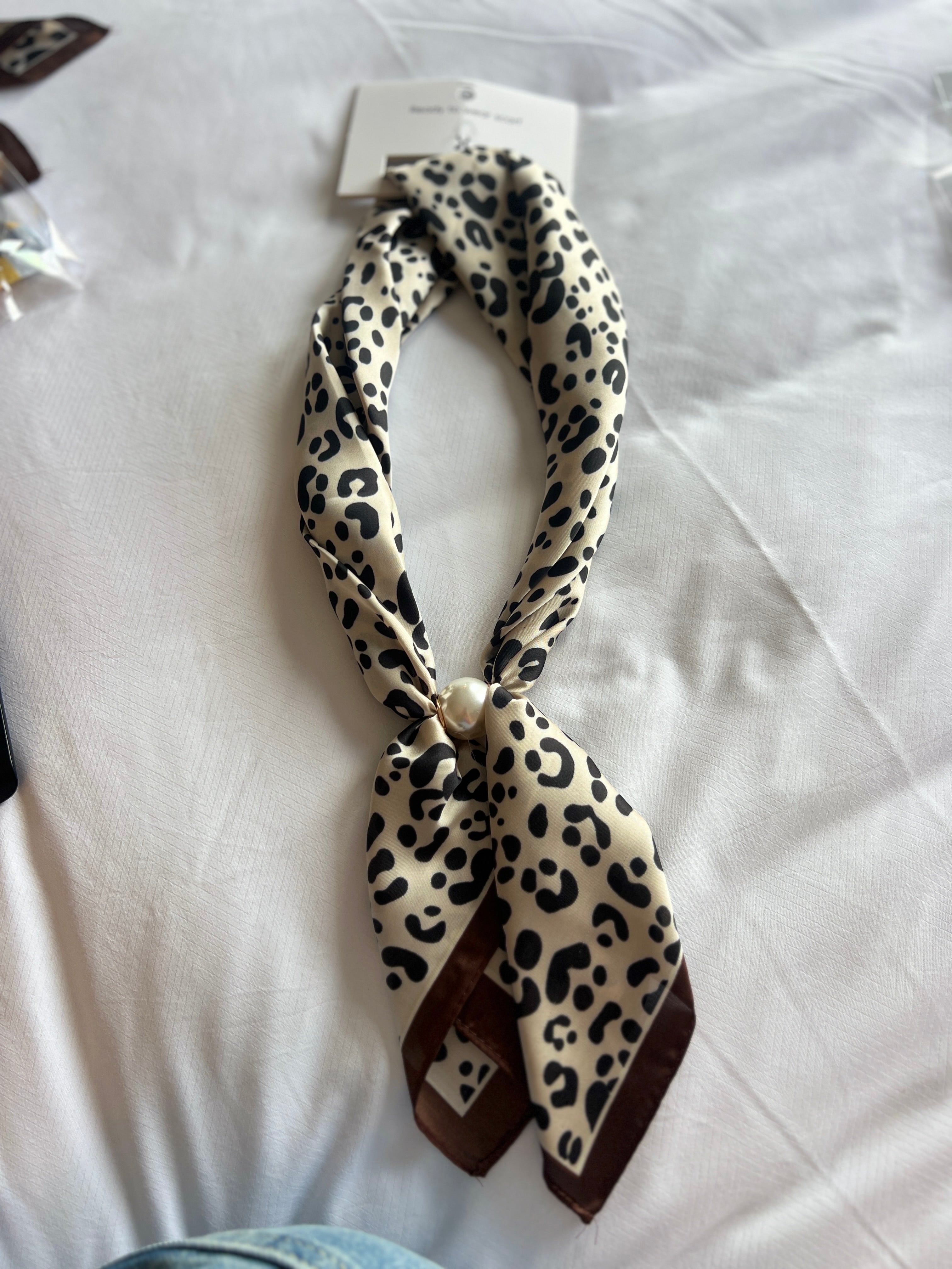 Leopard print scarf necklace with black bow tie and long scarf tails