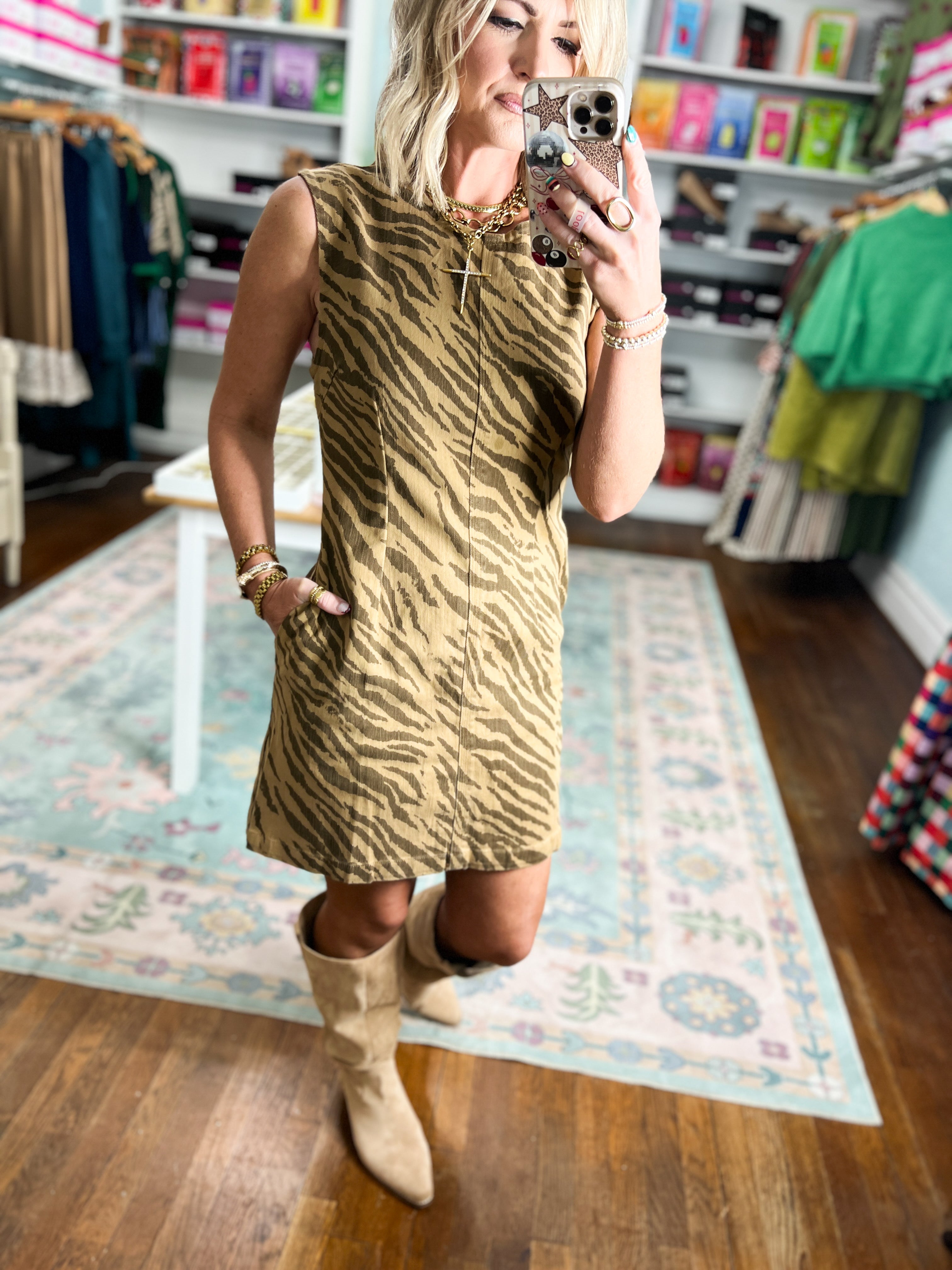 Brown tiger-print mini dress with a straight silhouette and sleeveless high neckline.