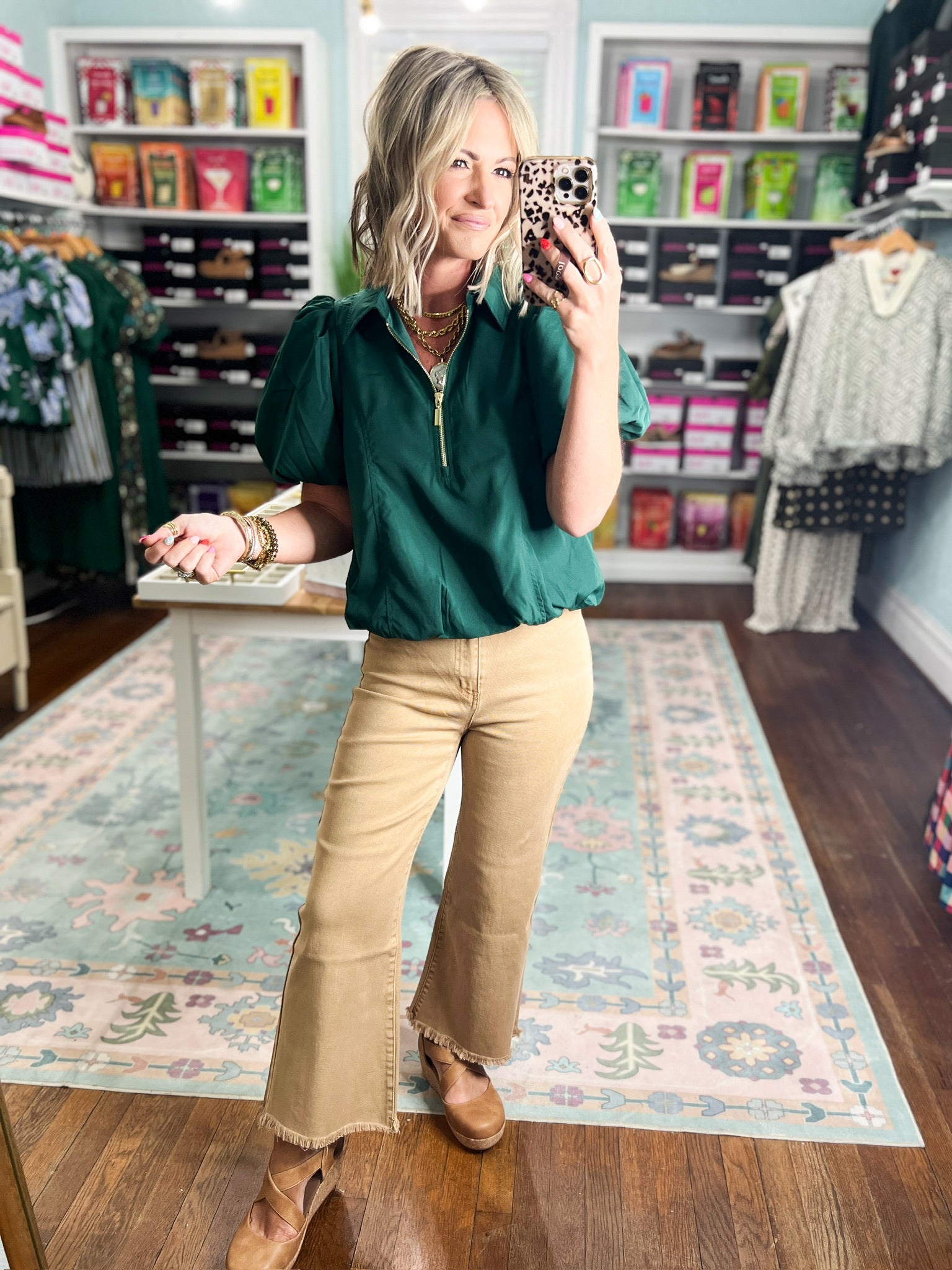 Hunter green puff-sleeve half-zip top with short puff sleeves