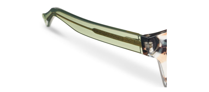 Side view of tortoise eyeglass frame with green temple and clear nose bridge