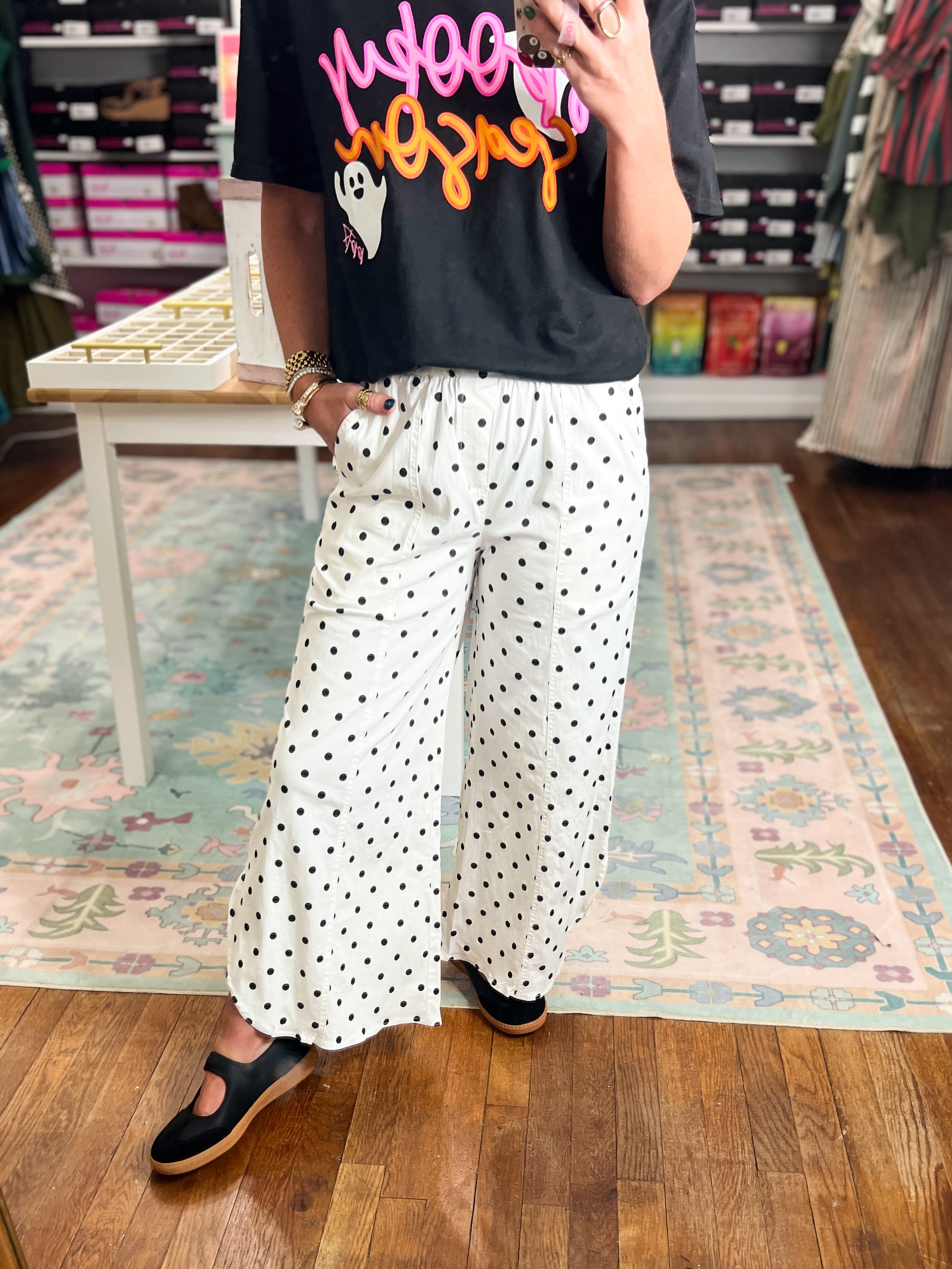Ivory dot wide-leg pants with relaxed drape and gathered elastic waist