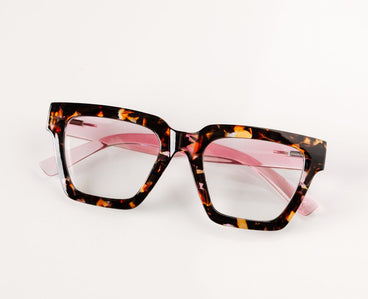 Peepers progressive reading eyeglasses, tortoiseshell frame with pink-tinted lenses, angled view