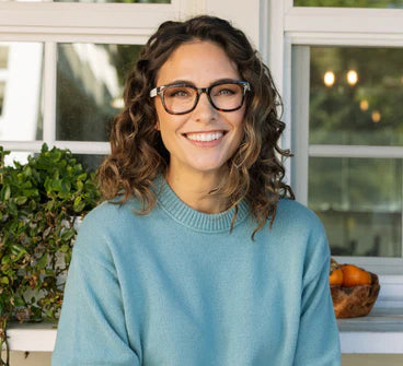 Tortoise eyeglasses on model with clear rectangular lenses