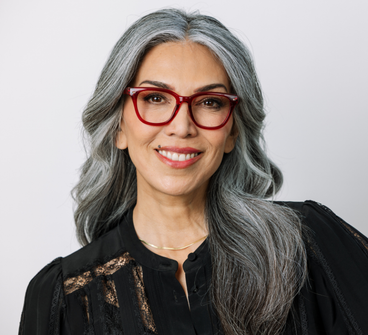Red rectangular eyeglasses with tortoise-look temples on model