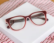 Progressive eyeglasses, cherry-and-pink frames with rounded rectangular lenses