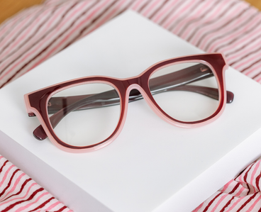 Progressive eyeglasses, cherry-and-pink frames with rounded rectangular lenses
