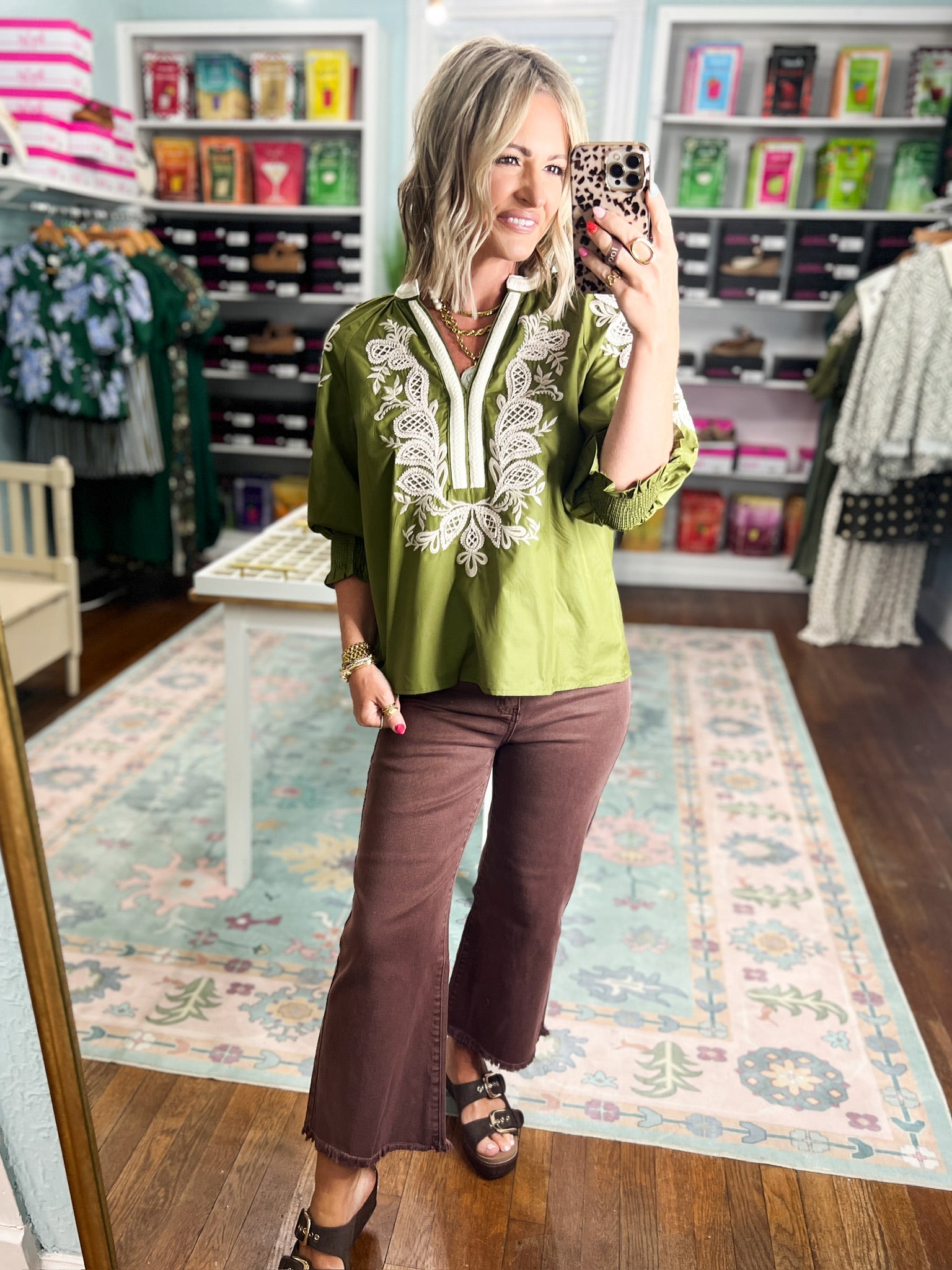 Olive embroidered top with white yoke embroidery and three-quarter sleeve cuffs
