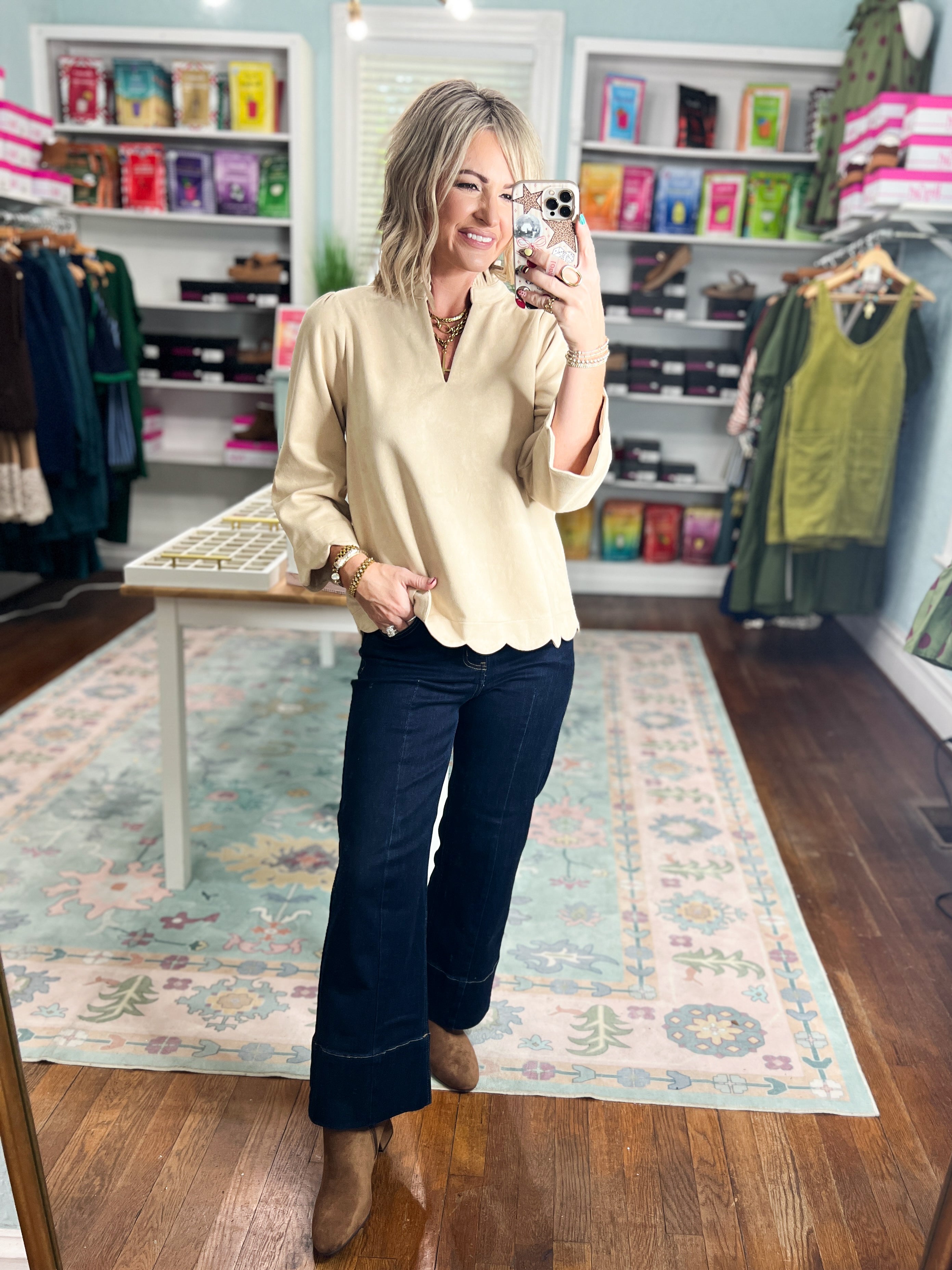 Champagne faux suede top with V-neck and scalloped hem, front view with long sleeves.