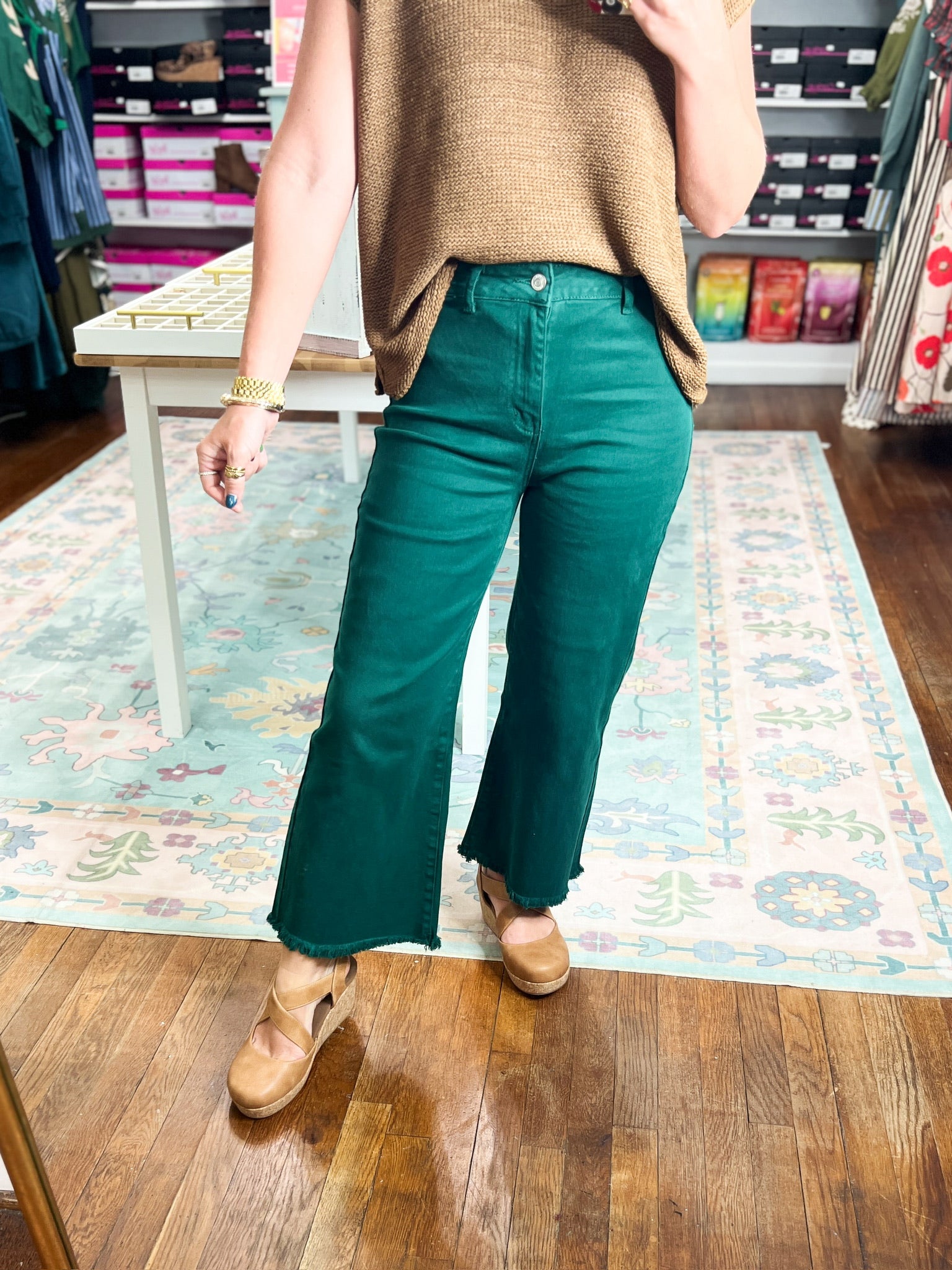 Hunter green straight pants with frayed hem and ankle-length flare
