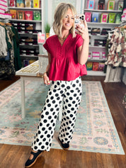 Crimson poplin top with gathered peplum hem, short sleeves, and button-front