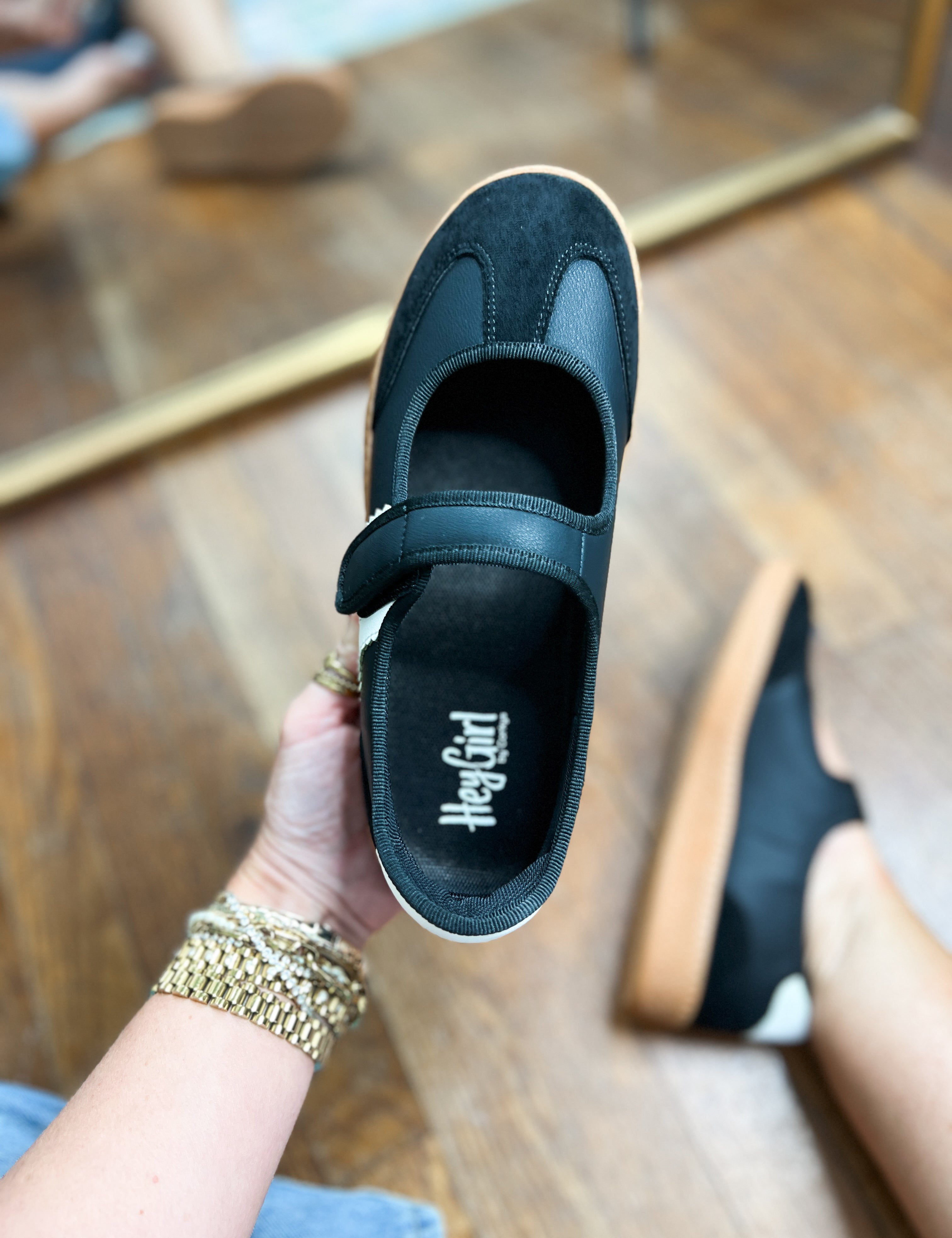 Corkys Calm Down slip-on sneaker interior view, dark teal upper with logo on footbed