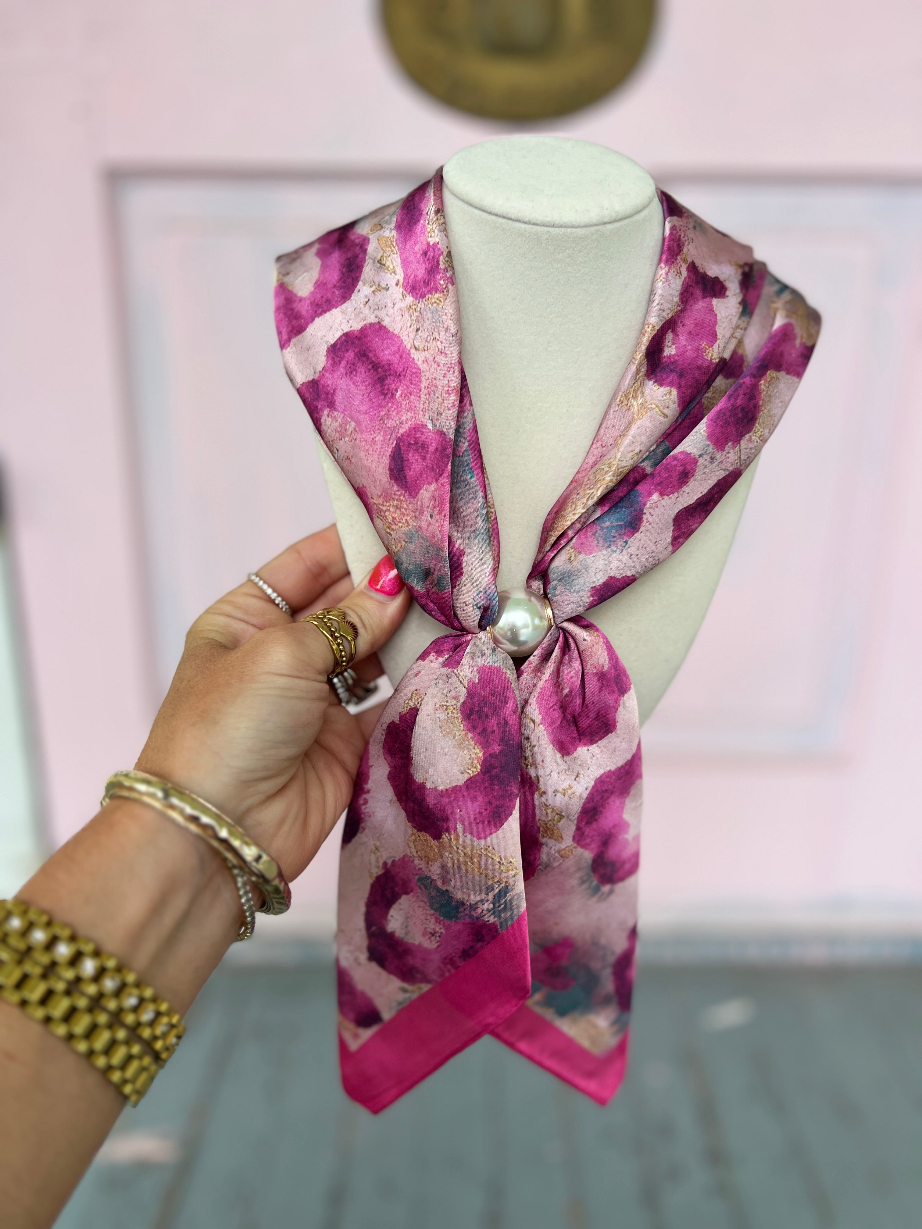 Pearl scarf necklace with pink and purple abstract print, draped with knot and pearl pendant