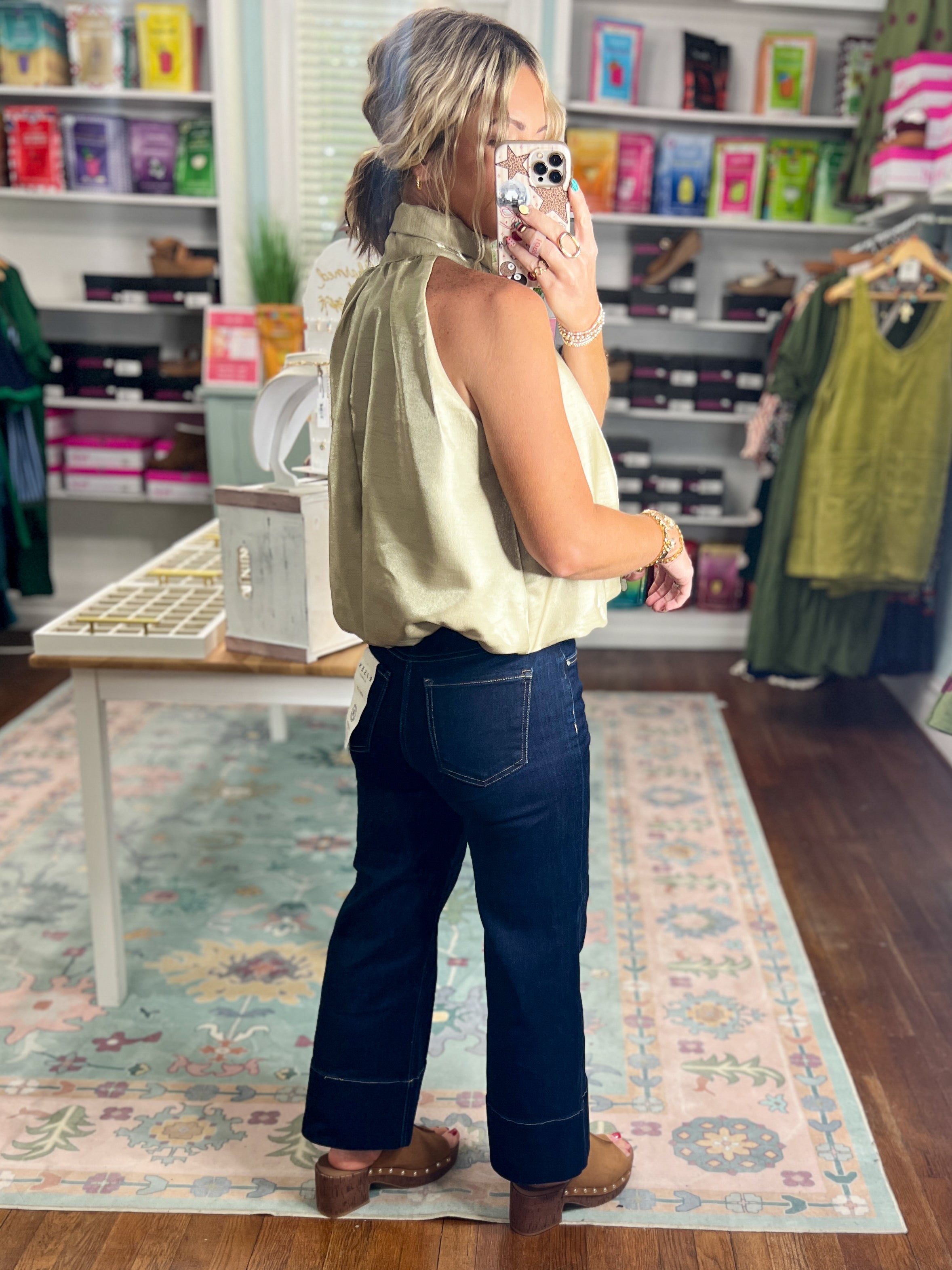Taupe sleeveless balloon top with gathered neck and loose ruffle detail
