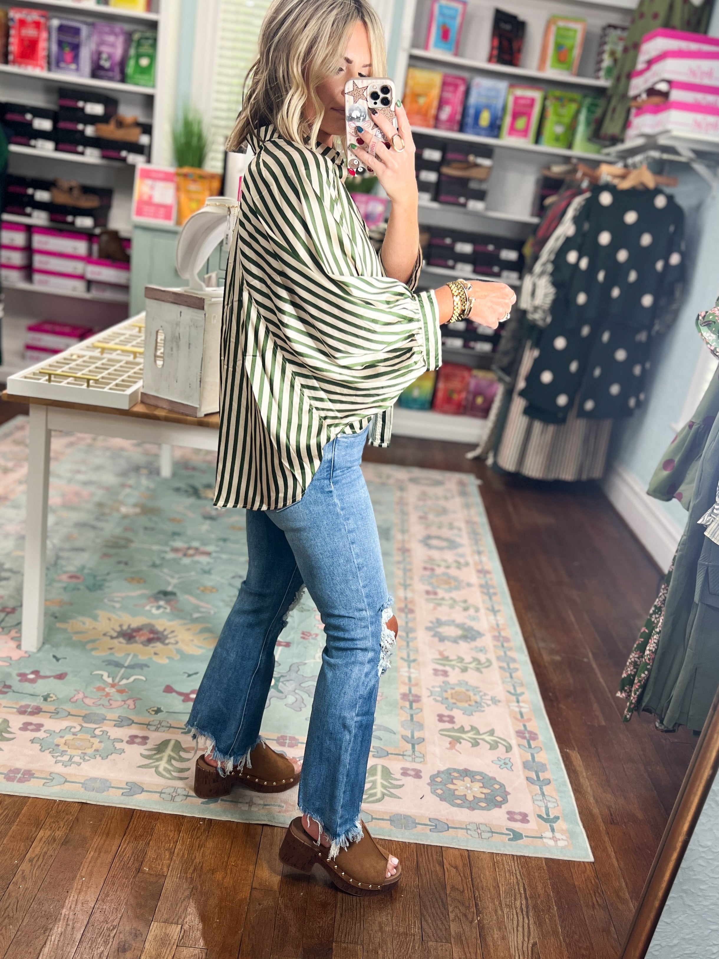 Olive vertical-striped button-down top with pointed collar and long sleeves