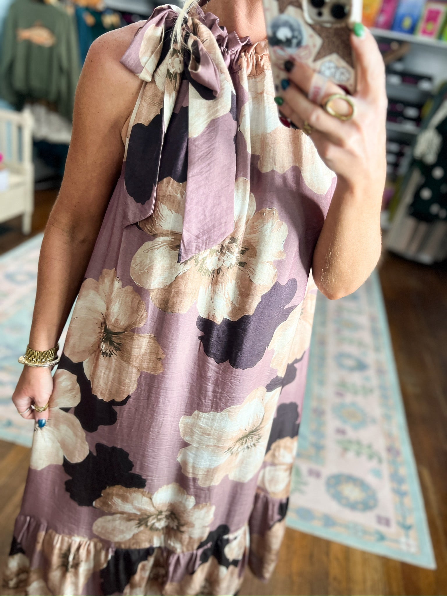 Sleeveless mauve midi dress with large floral print, ruffle trim and tie-neck detail
