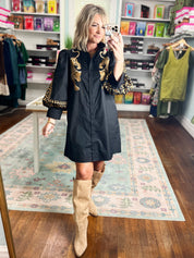 Black mini dress with gold leopard embroidery detail on front yoke and cuffs