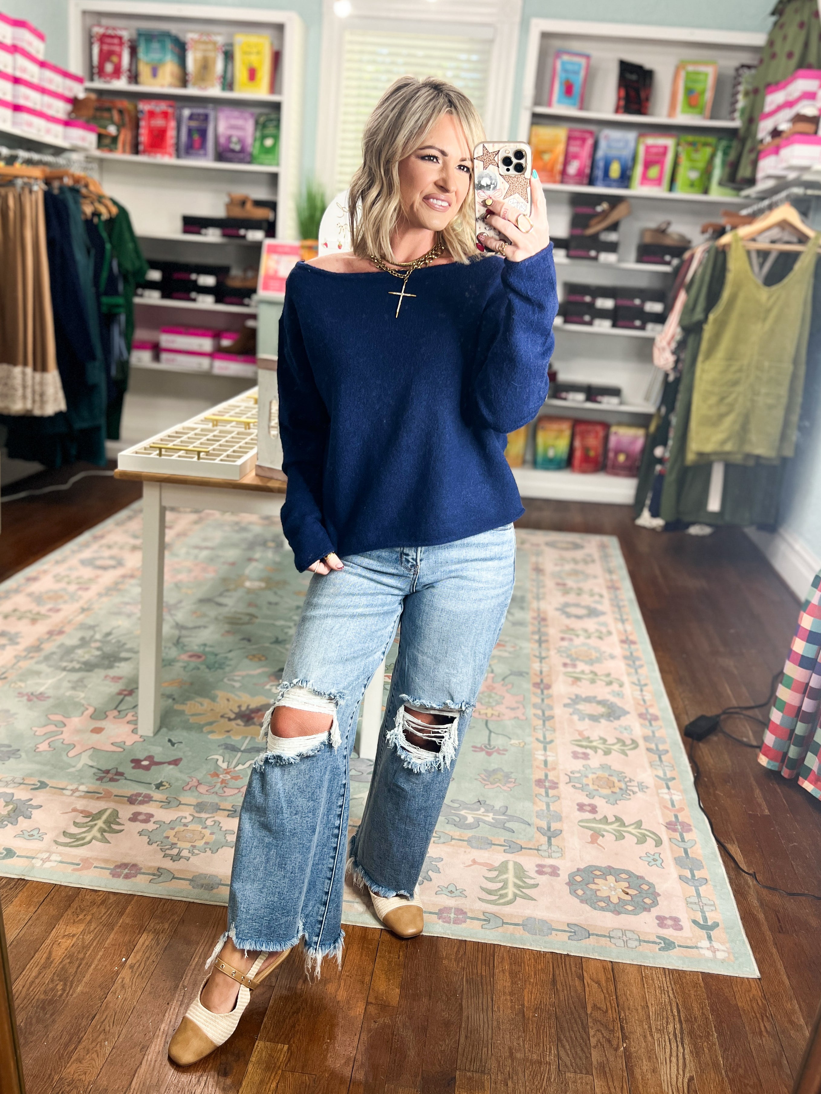 Navy off-shoulder sweater with long sleeves and relaxed fit