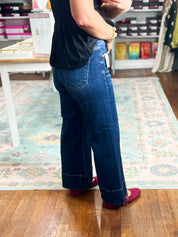 Deep blue wide-leg denim jeans, mid-rise crop, pintuck front detail