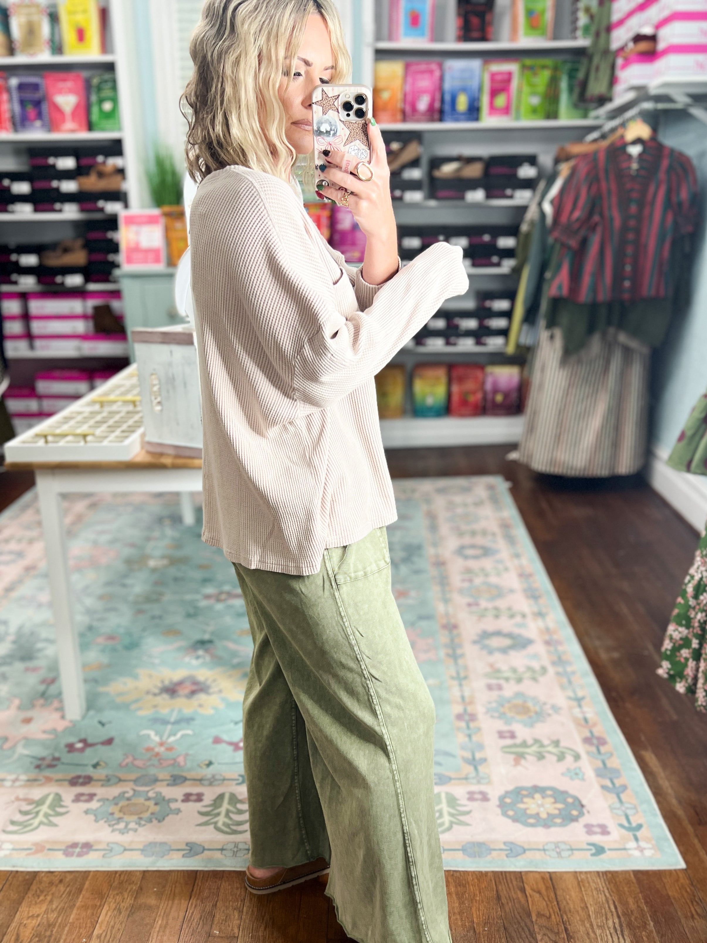 Light taupe mineral-washed long-sleeve pullover top with curved hem and chest pocket