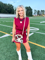 Burgundy sleeveless romper with gathered waist and front tie