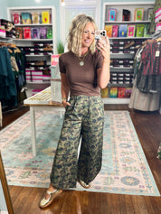 Camo relaxed-fit pants in green with elastic waist, relaxed wide-leg silhouette
