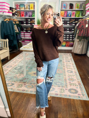 Dark brown off-shoulder knit sweater with long sleeves, relaxed fit