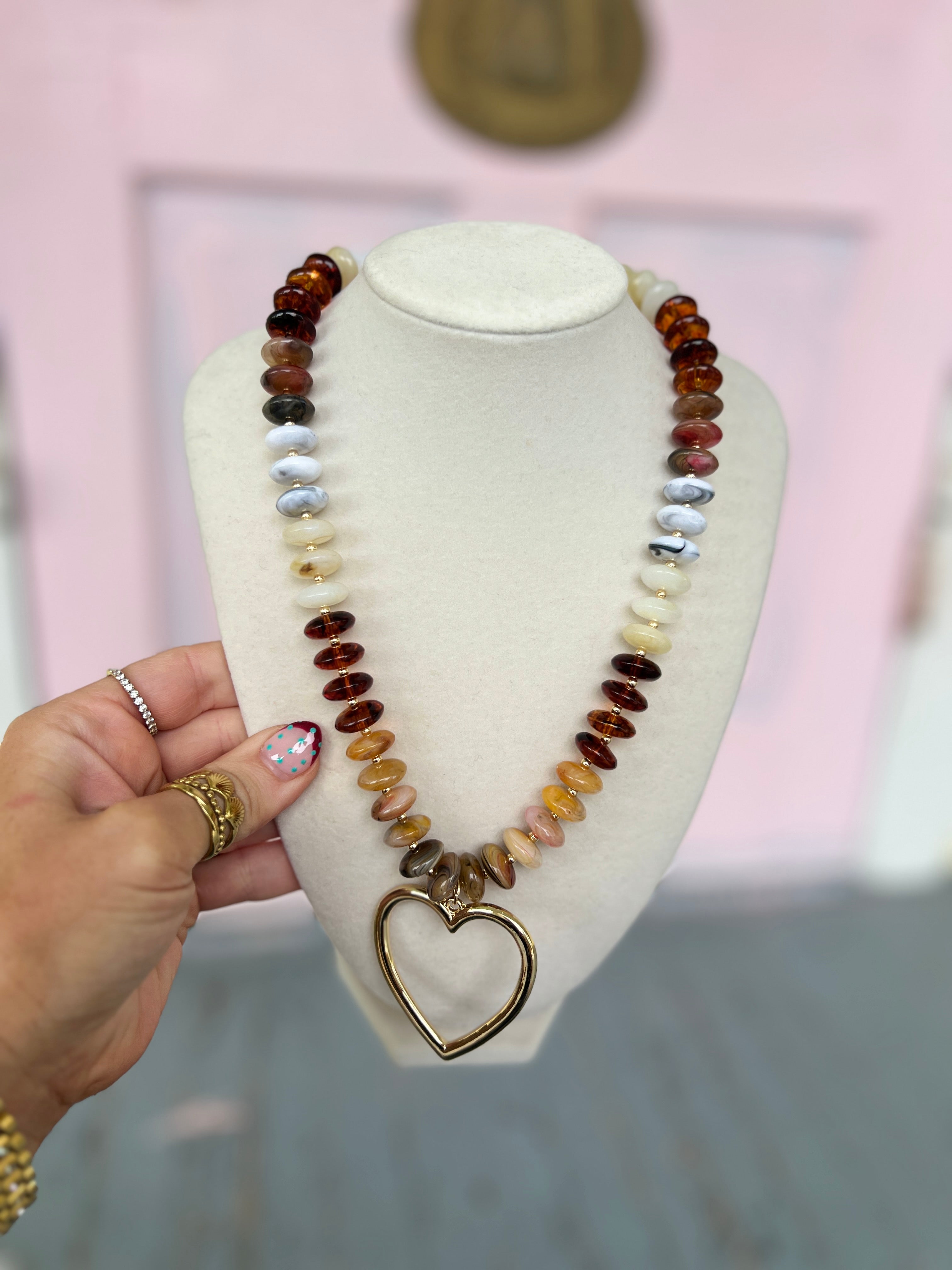 Bead heart pendant necklace with multicolor marble-style beads and gold-tone heart charm