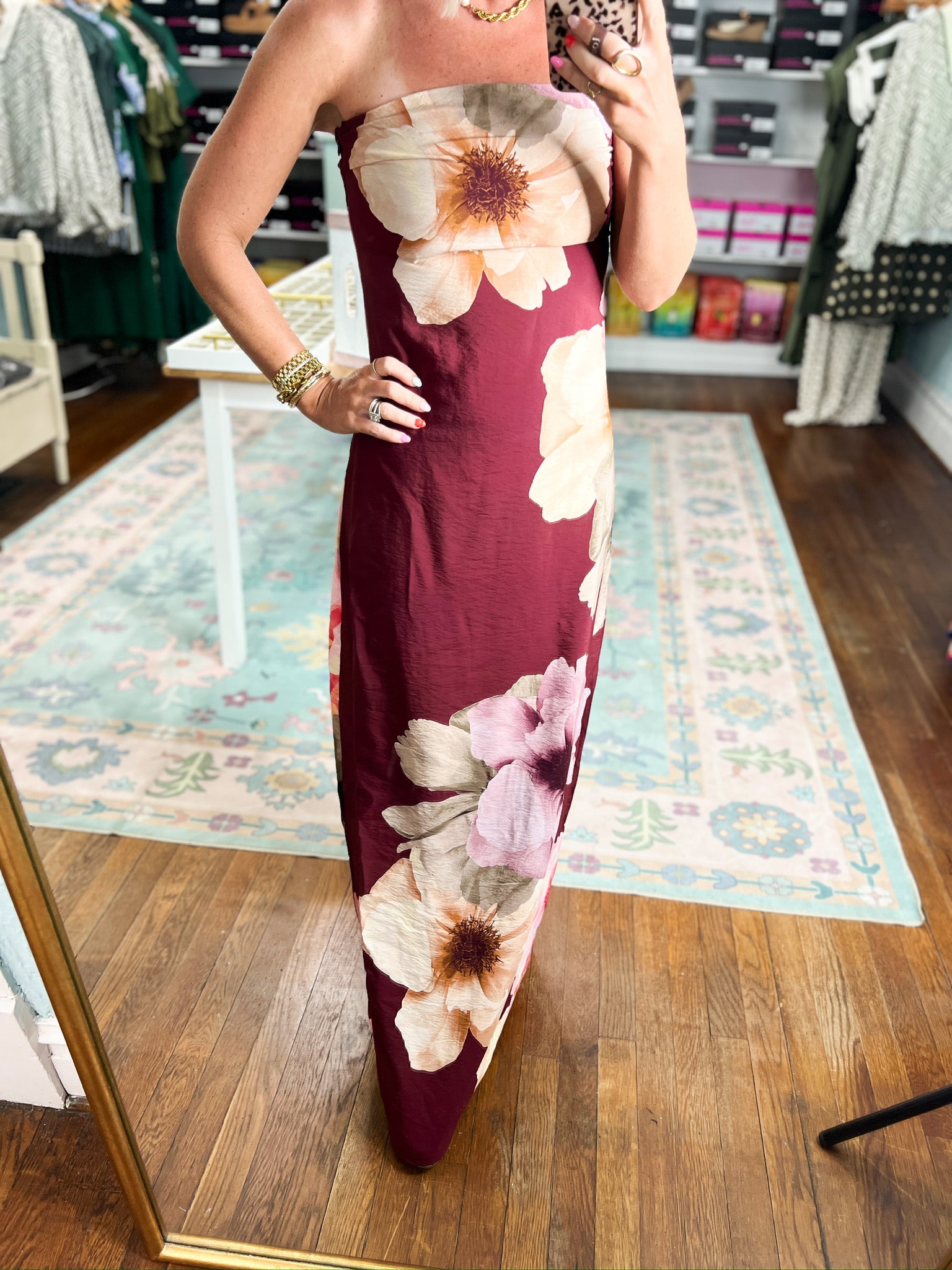 Burgundy strapless maxi dress close-up: cream and pink floral print, sleeveless fitted design