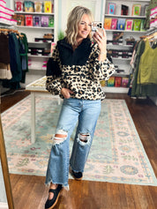 Leopard-print pullover, dark fuzzy fleece, long sleeves and button collar