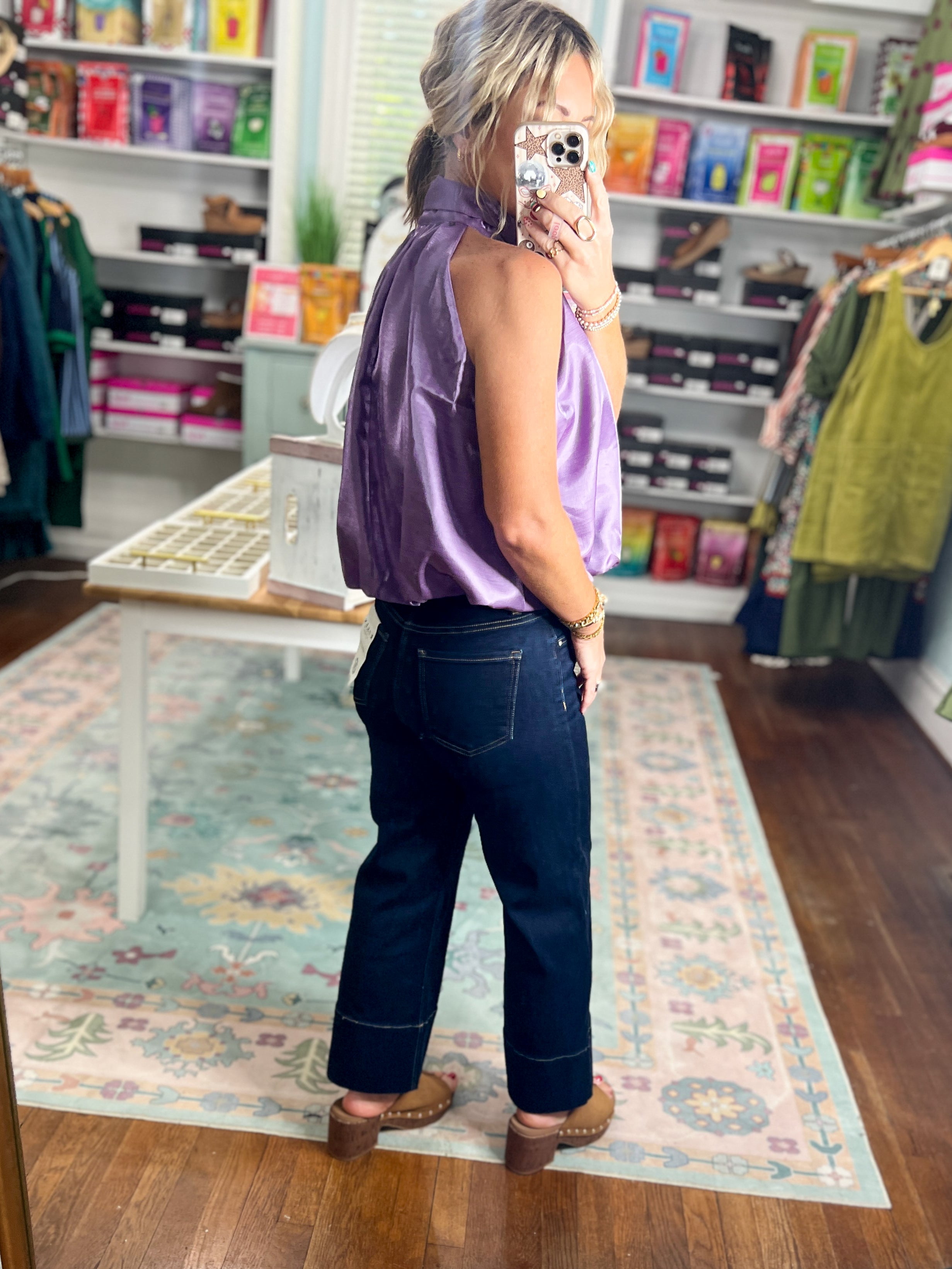 Purple sleeveless balloon top, draped back view with gathered shoulders